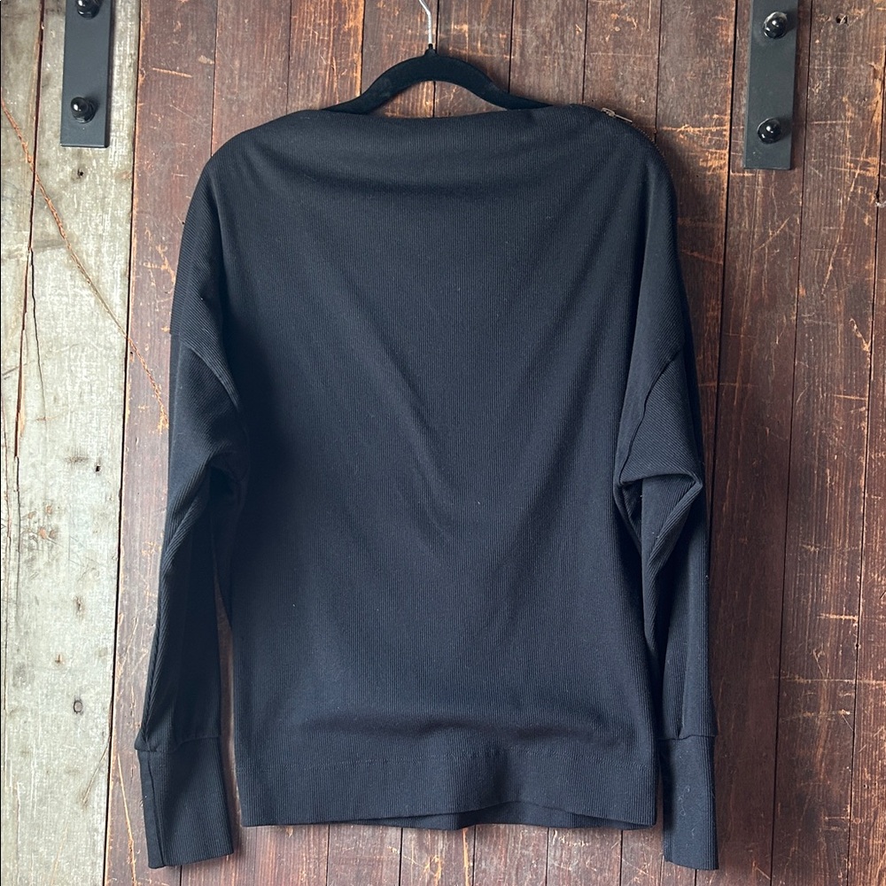 Elegant Black Women's off the shoulder shirt with zipper.  Size medium